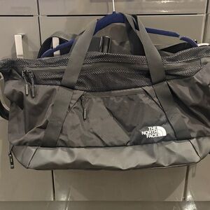 The North Face Black and Gray Duffel Bag…. Brand new, never used. Missing tags